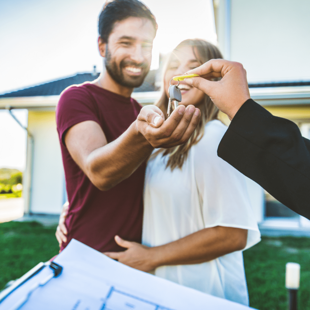 New home owners receiving house keys