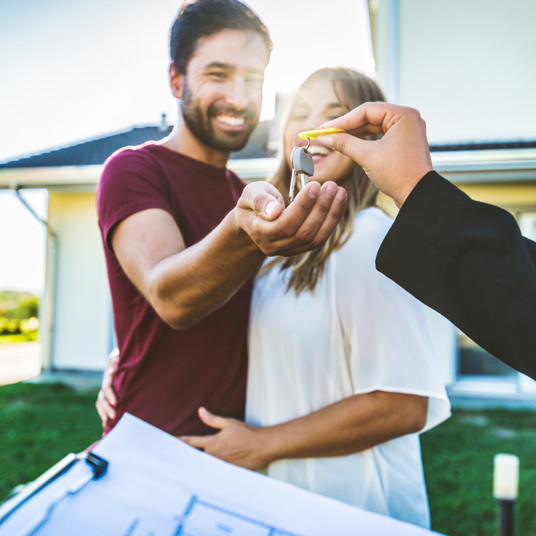 New home owners receiving house keys