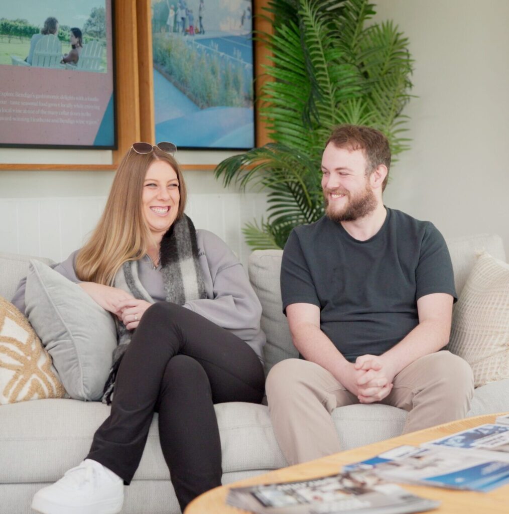 New home owners Tiarne and Caleb sitting in Harlowe office